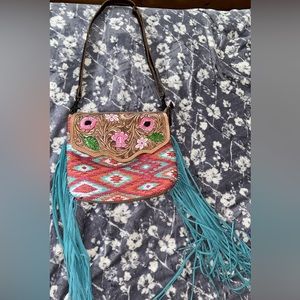 This is a Myra purse it’s brand new without tags. It’s never been used.